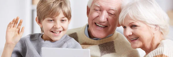 Grandson and grandparents using tablet — Stock Photo, Image