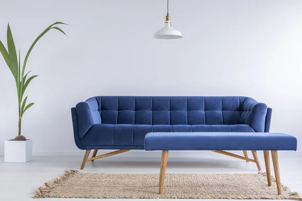 Quilted blue sofa and bench