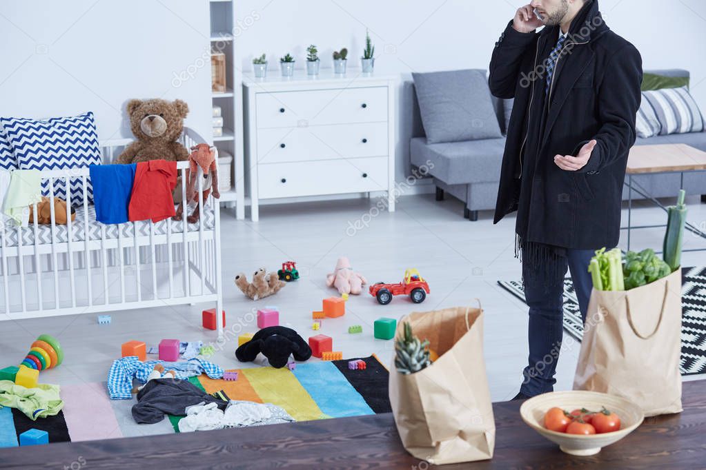 Man in messy nursery