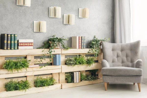 Books and plants on shelf