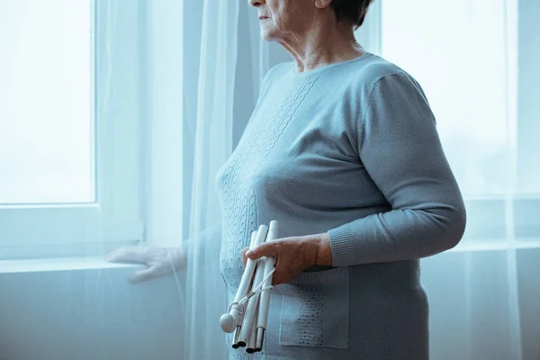 Blind woman holding white cane — Stock Photo, Image