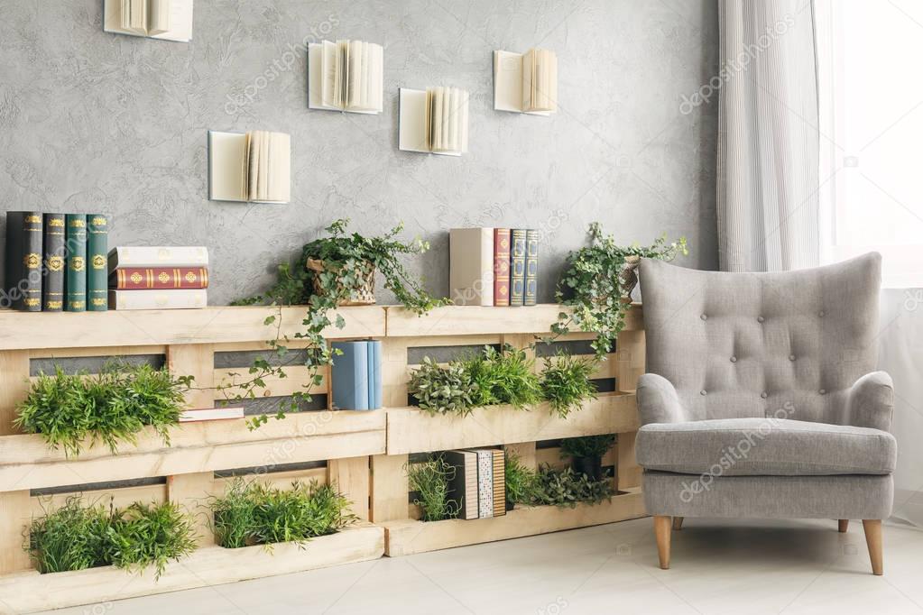 Books and plants on shelf — Stock Photo © photographee.eu 151090226