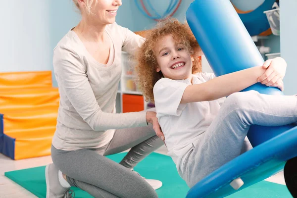Child on pediatric swing — Stock Photo, Image