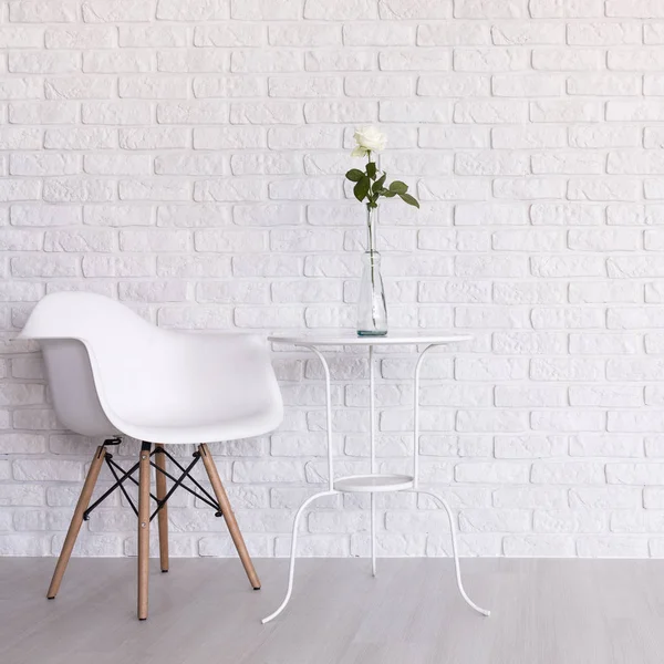 White simple room with modern chair