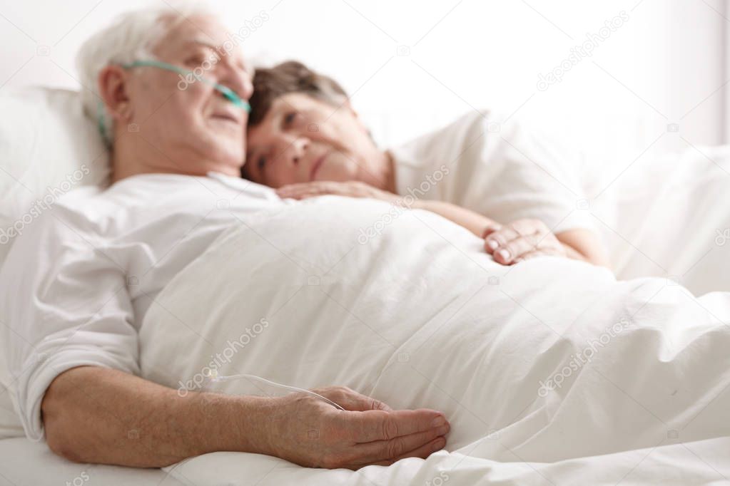 Loving wife hugging sick husband