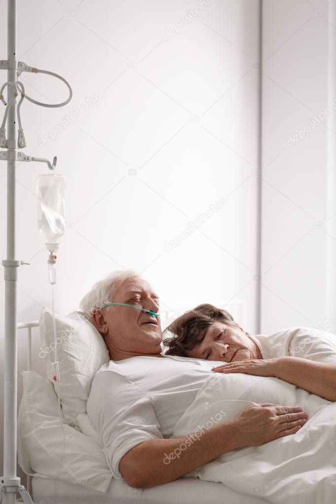 Dying husband in hospital bed