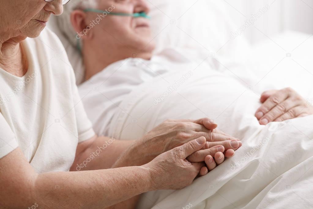 Marriage holding hand's in hospital 