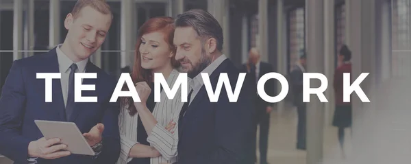 Teamwork inscription with businessmen and businesswoman — Stock Photo, Image