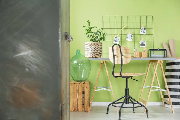 Green room with metal furniture