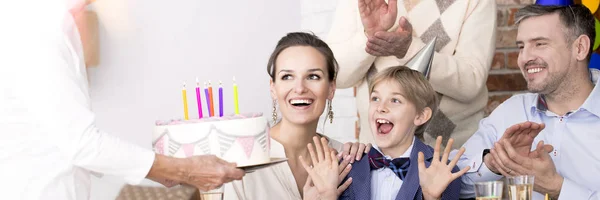 Boy delighted with his cake — Stock Photo, Image