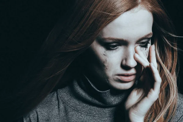 Beautiful woman covering tears — Stock Photo, Image