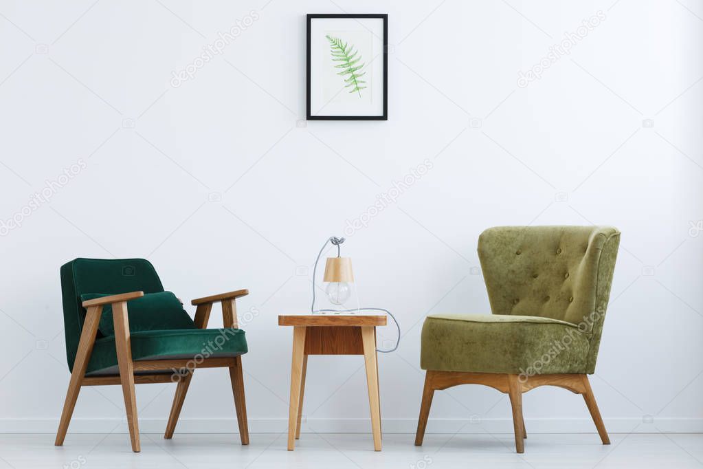 Ascetic interior with green chairs