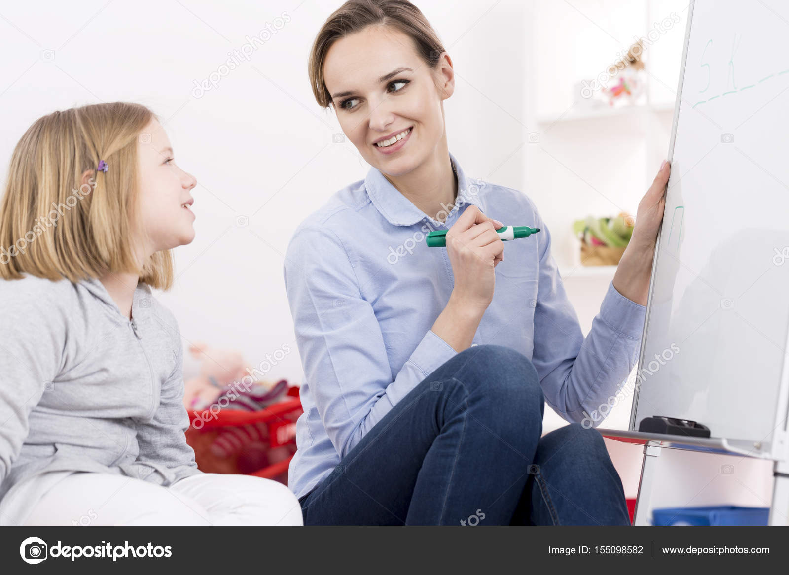 Therapist working with ADHD girl Stock Photo by ©photographee.eu 155098582
