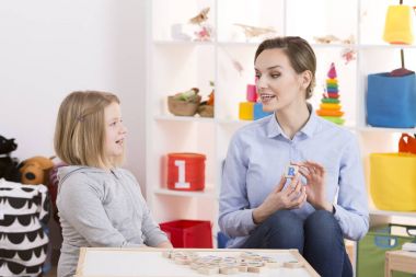 Little girl during speech therapy clipart