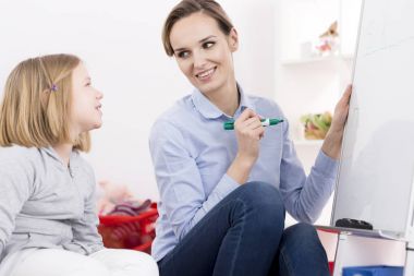 Therapist working with ADHD girl  clipart