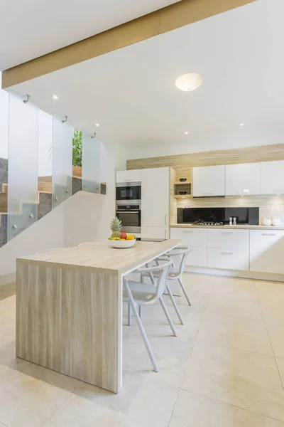 Kitchen with countertop and bar stools — Stock Photo, Image