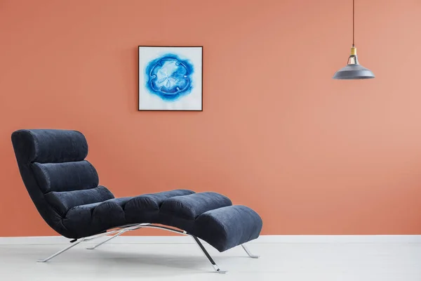 Orange wall and blue couch — Stock Photo, Image