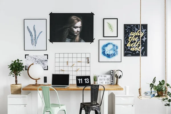 Posters on a wall in home office — Stock Photo, Image