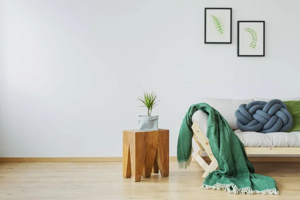 Green blanket on the sofa — Stock Photo, Image