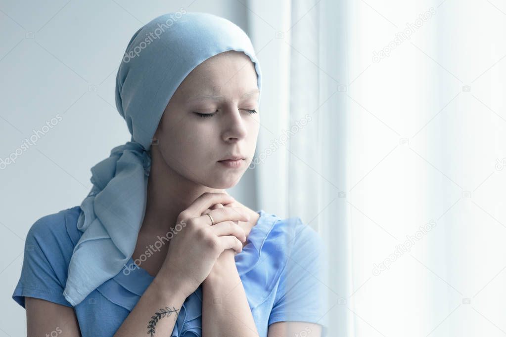 Woman with cancer praying