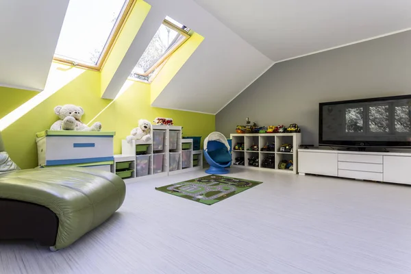 Child room at the attic with TV set — Stock Photo, Image