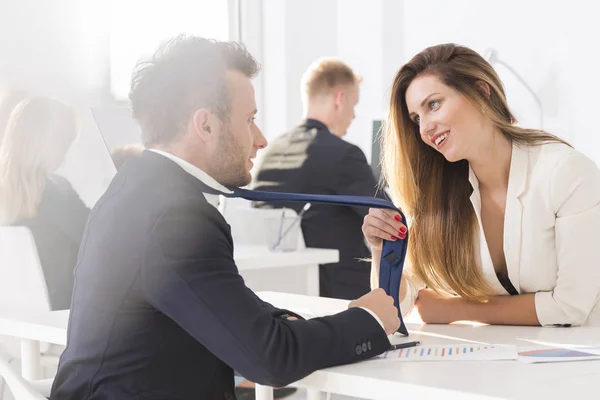 Woman holding tie — Stock Photo, Image