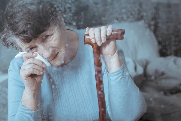 Senior lady with a tissue — Stock Photo, Image