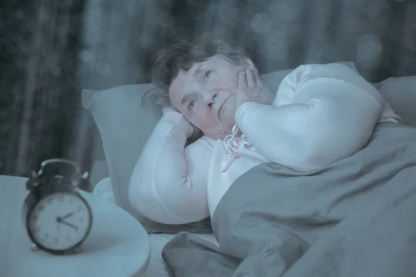 Older lady trying to sleep — Stock Photo, Image