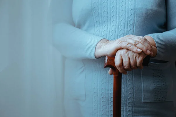 Lady with walking stick — Stock Photo, Image