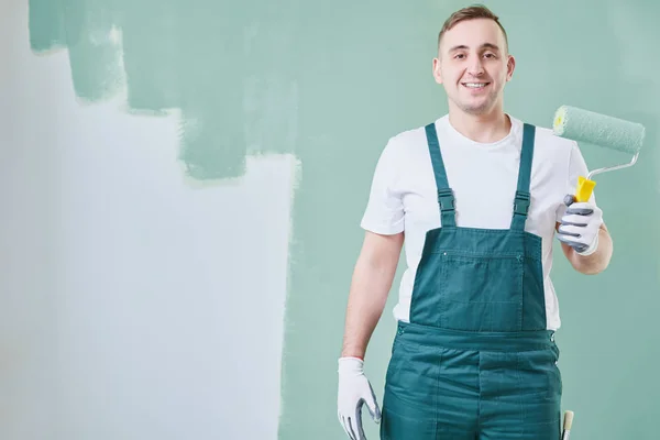 Painter holding a roller — Stock Photo, Image