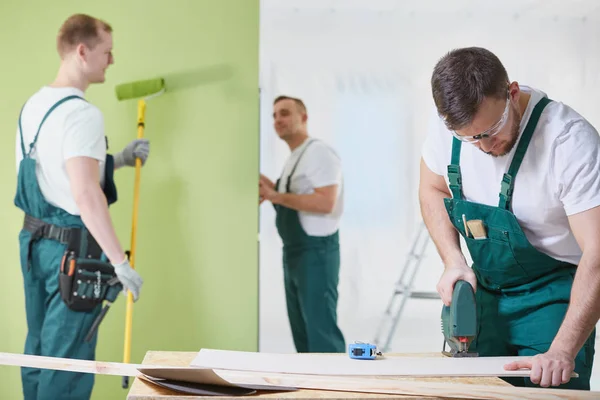 Three workers having a renovation