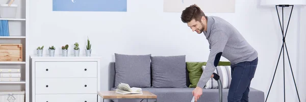 Single man vacuuming — Stock Photo, Image