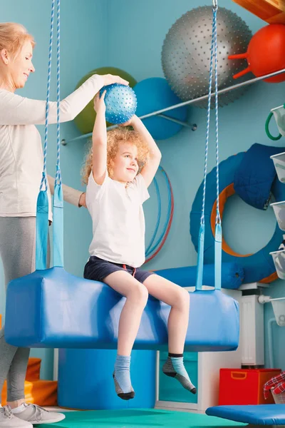 Boy exercising with ball — Stock Image Boy exercising with ball Royalty Free Stock Photos