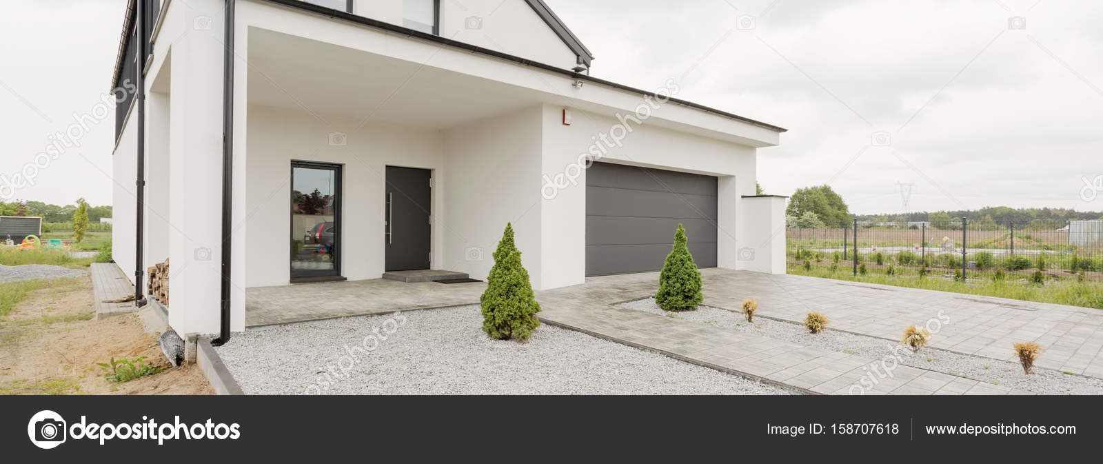 Big house with car garage — Stock Photo © photographee.eu #158707618, image size:1600x673