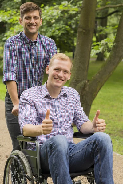 Disabled man with his brother — Stock Photo, Image