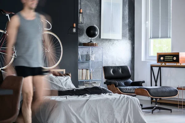 Man in a bedroom — Stock Photo, Image