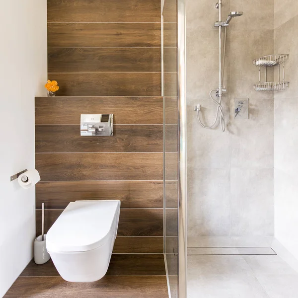 Bathroom with wood and travertine decor — Stock Photo, Image