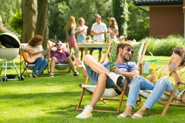 Laughing and drinking — Stock Photo, Image