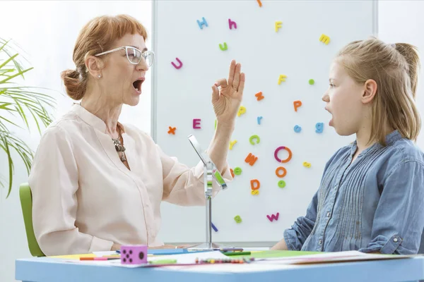 Little girl during speech therapy — Stock Photo, Image