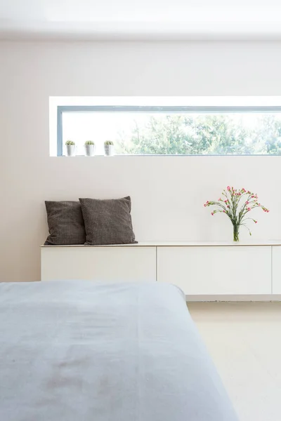 White cabinet and horizontal window — Stock Photo, Image