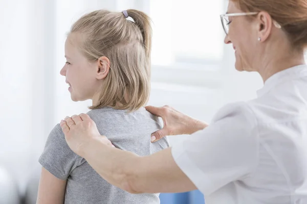 Child being given back massage — Stock Image Child being given back massage Stock Image