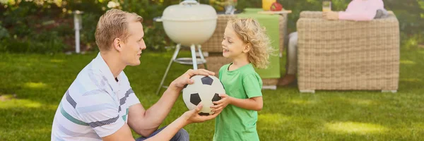 Man and boy with ball — Stock Photo, Image