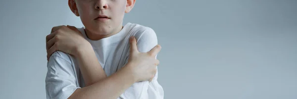 Boy embracing himself — Stock Photo, Image