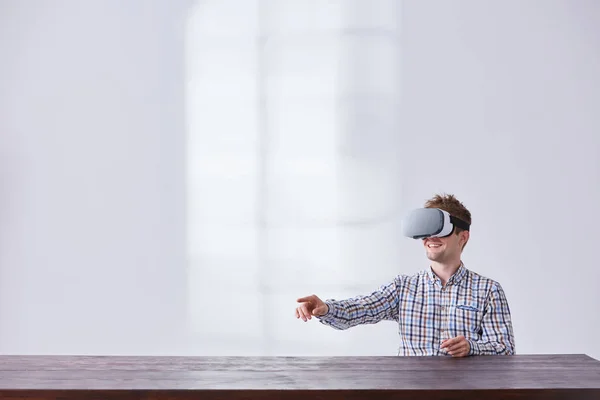 Young guy using innovative glasses — Stock Photo, Image