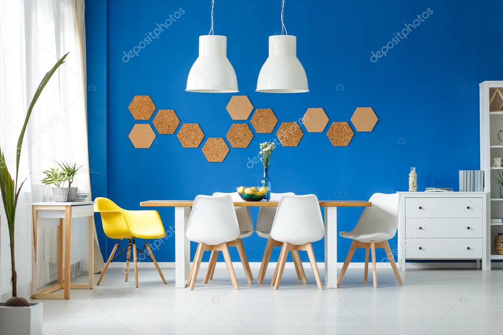 Trendy room with yellow chair