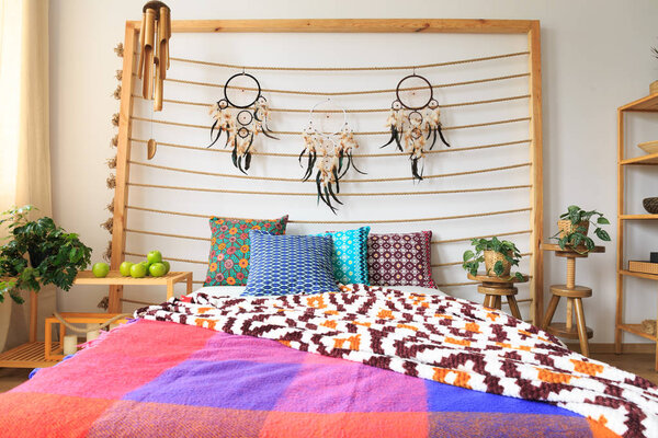 Bed with ethnic decorations