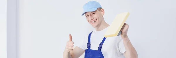 Man holding plastering sponge float — Stock Photo, Image