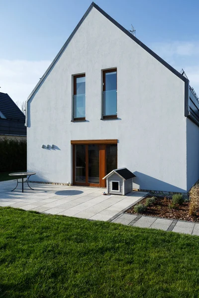 Home exterior with wooden door — Stock Photo, Image