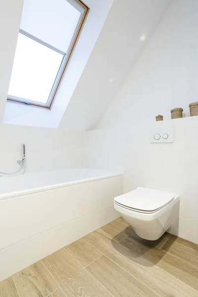Stylish attic bathroom in white — Stock Photo, Image