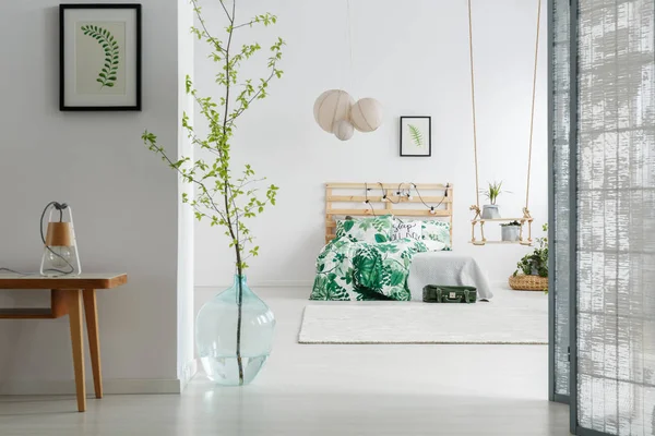 Bedroom with branch in vase — Stock Photo, Image